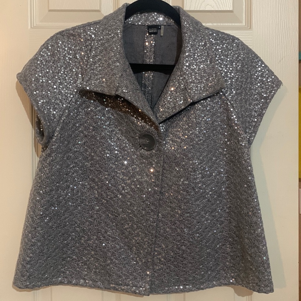 600 west  Silver sequined short sleeve over jacket.